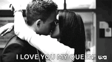 a man and a woman are kissing in a black and white photo with the words `` i love you my queen '' .