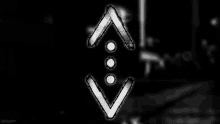 a black and white image of a symbol with three arrows pointing in opposite directions .