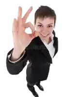 a woman in a black suit is giving an ok sign