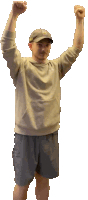 a man with his arms in the air wearing a nike sweatshirt and shorts