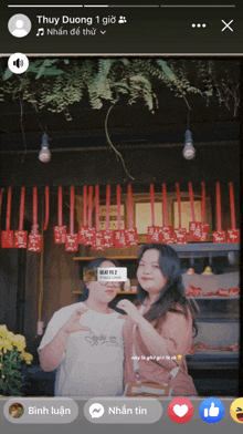 a man and a woman are posing for a picture with the name thuy duong at the top