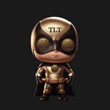 a figurine of a superhero with the word tlt on it