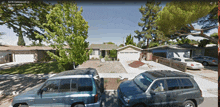 two cars are parked in front of a house on gatewood ln san jose california