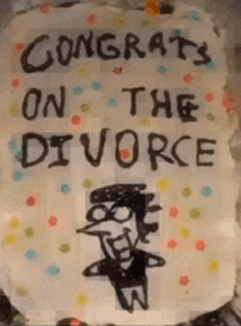 a sign that says congrats on the divorce with a picture of a man