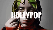 a poster for hollypop shows a woman wearing a helmet