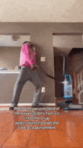 a person is using a vacuum cleaner to clean the floor