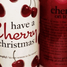 a bottle of have a cherry christmas lotion with cherries on it