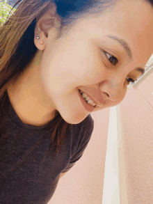 a close up of a woman 's face with earrings on her ears