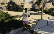 a man standing on a rock wearing a shirt with a diamond on it