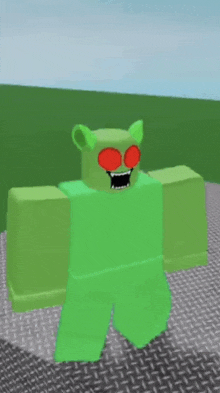 a green monster with red eyes and a mouth is standing on a metal surface .