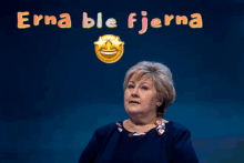 a woman stands in front of a sign that says " erna ble fjerna "