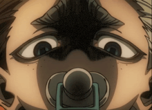 a close up of a person 's face with a pacifier on it