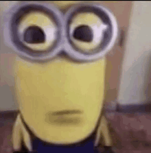 a close up of a minion wearing glasses .