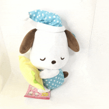 a stuffed animal has a tag that says sanrio characters