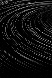 a black background with white lines that look like a spiral