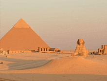 a pyramid and a sphinx are visible in the desert