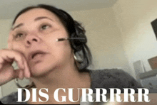 a woman wearing a headset with the words dis gurrrr on the bottom right