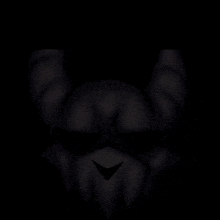 a close up of a person 's face in the dark