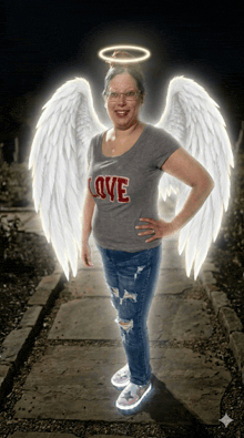 a woman with angel wings and a halo on her head is wearing a shirt that says love