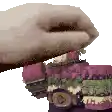 a pixelated image of a person holding a purple object