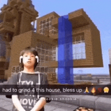 a young boy is standing in front of a minecraft house with a waterfall in the background .