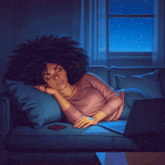 a woman laying on a couch with her head on a pillow
