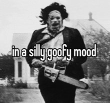 a man in a mask is holding a chainsaw with the words in a silly goofy mood above him