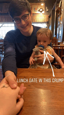 a man is holding a baby with a pacifier in his mouth and the words lunch date w this grump are below him