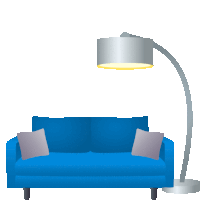 a blue couch with two pillows and a lamp