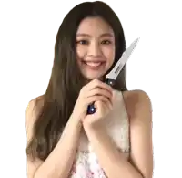 a woman is holding a knife with a sticker that says ' stainless steel ' on it