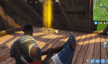 a man holding an axe in front of a gun in a video game with the time 2:26