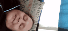 a woman laying on a bed with a pillow that says family rules