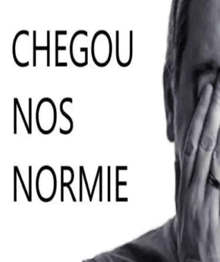 a man is covering his face with his hand and the words `` chegou nos normie '' are written above him .