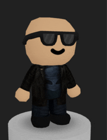 a doll wearing sunglasses and a black jacket