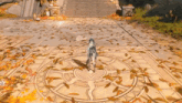 a woman standing in a circle of leaves