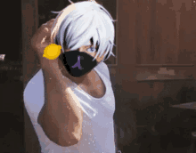 a man with white hair and a mask is holding a lemon in front of his face .