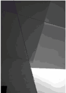 a black and white image of a triangle with a purple stripe on the corner .