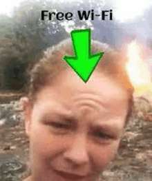 a woman is crying with an arrow pointing to her forehead .