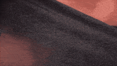a black flag with a red flame in a square on it