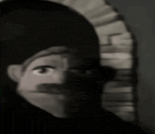 a black and white photo of a cartoon character with a mustache and a hat .