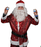 a man dressed as santa claus is holding up two coins that say ' christmas ' on them