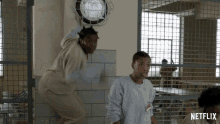 a netflix ad showing two women in a jail cell