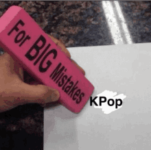 someone is holding a pink eraser that says for big mistakes kpop