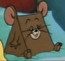 jerry from tom and jerry is sitting on a bed with his head on a pillow and smiling .