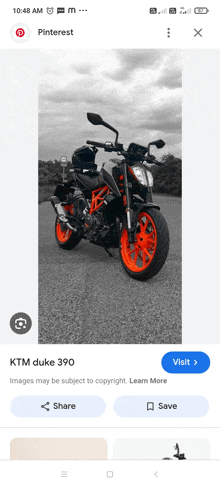 a picture of a ktm duke 390 is on a phone screen