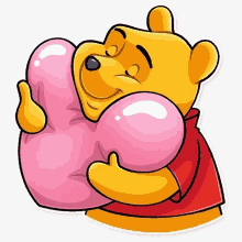 a sticker of winnie the pooh hugging a pink heart shaped pillow