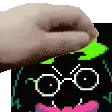 a close up of a person 's hand touching a pixel art of a face with glasses .