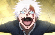 a man with white hair and blue eyes is making a funny face with his tongue out .