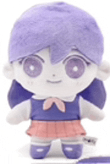 a stuffed doll with purple hair and a pink skirt is sitting on a white surface .