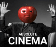 a man in a suit has an apple on his head and the words absolute cinema below him